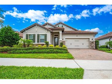 One-story home with a two-car garage and landscaped front yard at 11209 Lemon Lake Blvd, Orlando, FL 32836