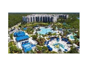 Resort-style community with large pools, water features, and expansive green areas at 14501 Grove Resort Ave # 2716, Winter Garden, FL 34787