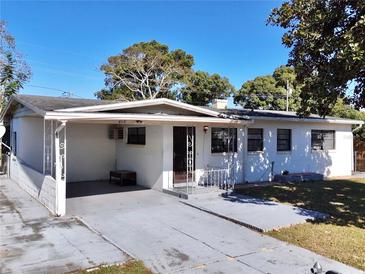 White single-story house with carport and fenced yard at 412 Clemson Dr, Altamonte Springs, FL 32714