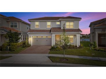Two-story house with gray siding, brown roof, and a two-car garage at 13333 Oakenshaw Ln, Orlando, FL 32832