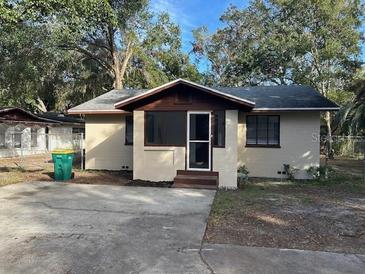 Charming bungalow home with a spacious front yard and mature trees at 1730 N Orange St, Mount Dora, FL 32757