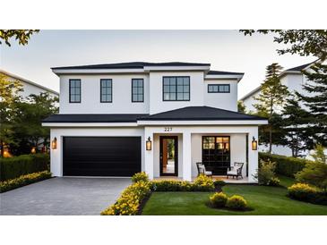 Stunning two-story home with a modern design and landscaped front yard at 227 Page St, Orlando, FL 32806