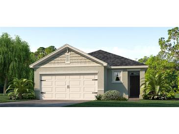 One-story home with a gable roof, attached garage, and attractive landscaping at 7103 Carib Grackle Dr, Saint Cloud, FL 34773