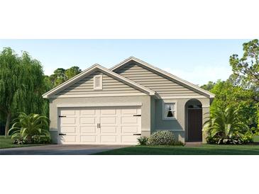 One-story home with a two-car garage and attractive landscaping at 1610 Bull Hill Rd, Kissimmee, FL 34744