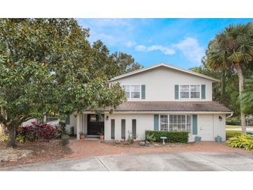 Two-story house with brick facade, landscaping, and a brick driveway at 2351 Westwood Dr, Longwood, FL 32779