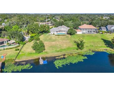 Stunning waterfront property with pool and large lot at 9664 Weatherstone Ct, Windermere, FL 34786