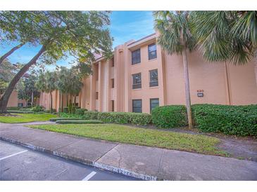 Condo building with landscaping and convenient parking at 620 Cranes Way # 207, Altamonte Springs, FL 32701