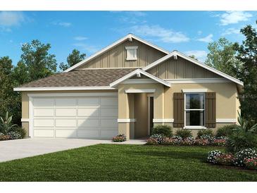 One-story home with a two-car garage and landscaped front yard at 4873 Cypress Ember Ln, Sanford, FL 32771