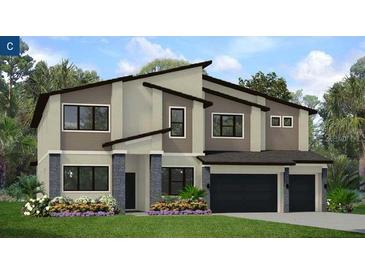 Two-story home with modern design, two-car garage, and landscaped front yard at 3921 Sonoma Blvd, Kissimmee, FL 34741