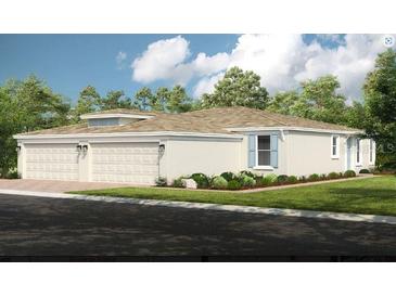 Two-story home with three-car garage and attractive landscaping at 5338 Spoonflower Ct, Saint Cloud, FL 34771
