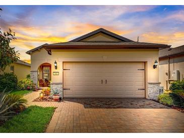 Attractive single-story home with a two-car garage and well-manicured landscaping at 541 Cantabria Dr, Davenport, FL 33837