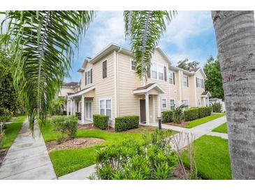 Attractive townhome with landscaped yard and walkway at 2901 Edenshire Way # 104, Kissimmee, FL 34746