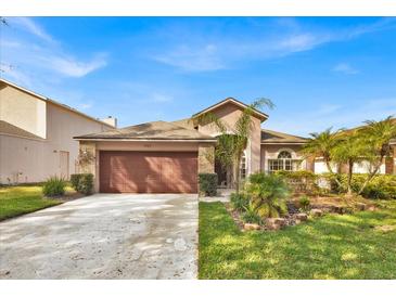 Charming single-Gathering home with a two-car garage and landscaped front yard at 1984 Westpointe Cir, Orlando, FL 32835