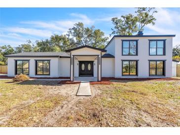 Stunning two-story home with modern exterior and landscaping at 1315 Wheeler Rd, Apopka, FL 32703