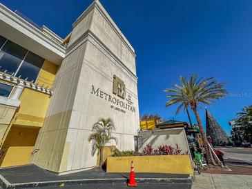 Modern building exterior with palm trees and signage at 151 E Washington St # 201, Orlando, FL 32801