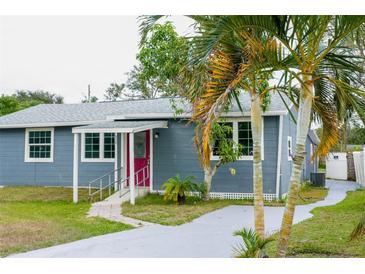 Newly renovated home featuring gray exterior, landscaping, and a paved driveway at 577 Maxey Ave, Winter Garden, FL 34787