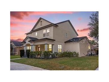 Charming two-story home at sunset at 12507 Overstreet Rd, Windermere, FL 34786