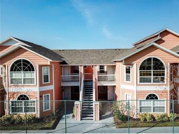 Attractive two-story condo building with balconies and stairs at 8711 Rockingham Ter # D, Kissimmee, FL 34747