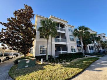 Inviting condo building with lush landscaping and ample parking at 3300 Whitestone Cir # 306, Kissimmee, FL 34741