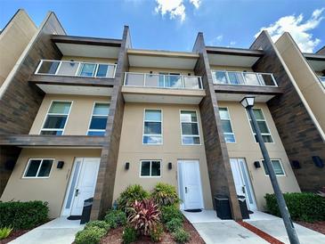 Modern townhome community with three-story buildings and private entrances at 3185 Brasilia Ave, Kissimmee, FL 34747