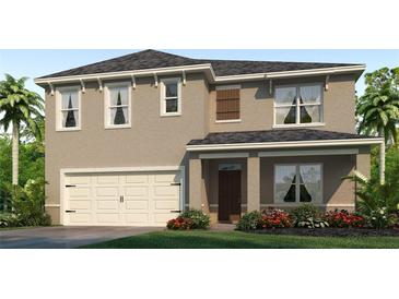 Two-story house with beige exterior, shutters, and a two-car garage at 11124 Amber Ridge Dr, Zellwood, FL 32798