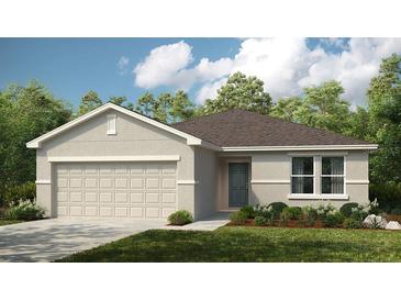 Single-story home with two-car garage and landscaping at 329 River Front Way, Edgewater, FL 32141