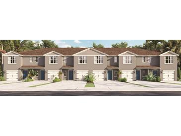 Three-unit townhome building with attached garages and neutral color palette at 2790 Puffin Pl, Davenport, FL 33837