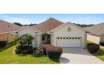 One-story home with 2-car garage and landscaped yard at 17846 Se 125Th Cir, Summerfield, FL 34491