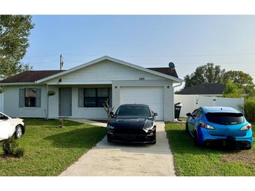 House exterior with a one car garage and a driveway at 4852 Sw 144Th St, Ocala, FL 34473