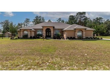 Spacious one-story home with landscaped yard at 10411 Sw 52Nd Ct, Ocala, FL 34476