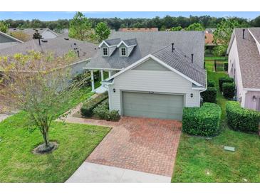 Two-story house with brick driveway and attached garage at 3554 Nw 55Th Cir, Ocala, FL 34482