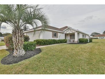 House exterior, single-story home with palm tree and lawn at 5247 Nw 18Th St, Ocala, FL 34482
