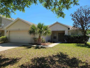 Single-Gathering home with a two-car garage and well-maintained lawn at 5598 Sw 39Th St, Ocala, FL 34474