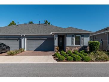 House exterior with gray siding and two-car garage at 5237 Nw 34Th St, Ocala, FL 34482