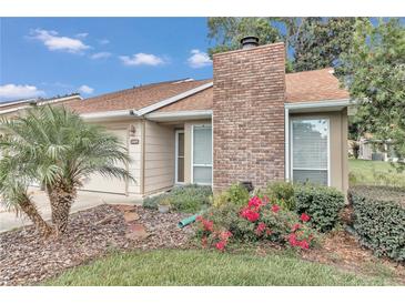 Well-maintained house with brick chimney and landscaped front yard at 2309 Se 19Th Cir, Ocala, FL 34471