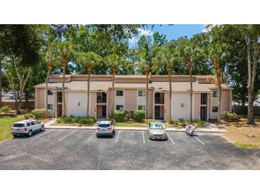 Townhome building exterior with parking and landscaping at 2915 Sw 32Nd Ave # C3, Ocala, FL 34474