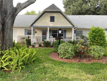 Cute cottage with porch, landscaping and stone accents at 8841 Sw 91St St # D, Ocala, FL 34481