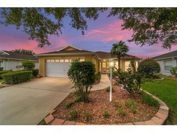 House exterior at dusk showcasing landscaping and driveway at 9372 Sw 90Th St, Ocala, FL 34481