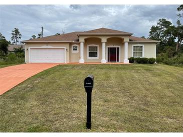 One story house with columns and two car garage at 15747 Sw 47Th Avenue Rd, Ocala, FL 34473