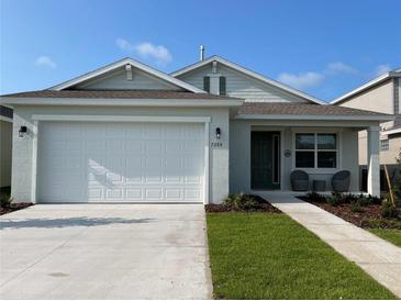 Charming one-story home with a two-car garage and landscaped front yard at 7288 Sw 64Th Street Rd, Ocala, FL 34474