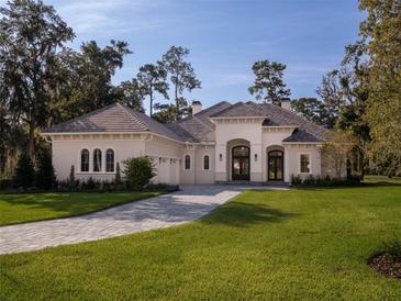 Stunning one-story home with a large driveway at 7578 Nw 33Rd Pl, Ocala, FL 34482