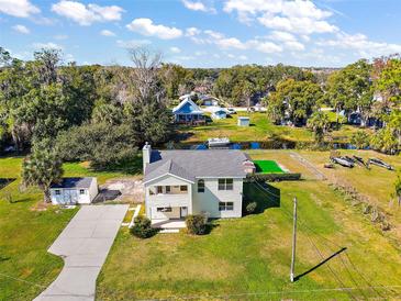 Two-story house with large backyard and dock at 10 Se Chinica Drive, Summerfield, FL 34491