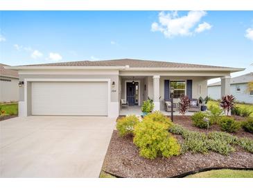 Single-story home with attached garage and landscaped front yard at 8924 Sw 76Th Ln, Ocala, FL 34481