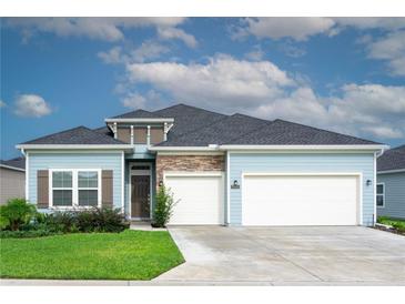 Newly built home with two-car garage and stone accents at 7531 Sw 77Th Ave, Ocala, FL 34481