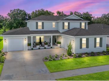 Stunning two-story home with a welcoming front porch at 7290 Sw 65Th Place Rd, Ocala, FL 34474