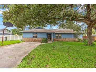 Ranch style home with carport and large yard at 5721 Se 22Nd Pl, Ocala, FL 34480