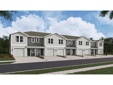 New townhouses with attached garages and neutral color palettes at 6599 Sw 81St Loop, Ocala, FL 34476