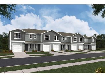 Row of townhouses with attached garages at 6595 Sw 81St Loop, Ocala, FL 34476