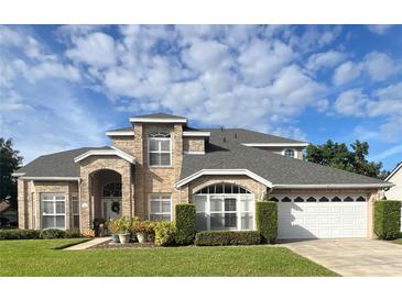 Two-story house with a large yard at 3403 Gatlin Place Cir, Orlando, FL 32812