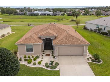 House with brown roof and landscaped yard, viewed from above at 15596 Sw 13Th Cir, Ocala, FL 34473